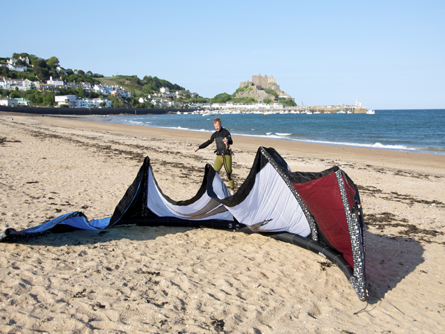 Kite surfer on the beach at Gorey, Jersey