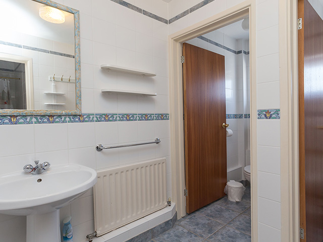 Bathroom with shower, toilet and basin