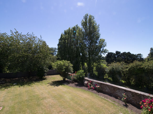 View from the twin bedroom upstairs shows the large private garden