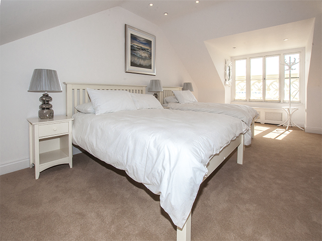 Spacious bedroom located on its own floor with double and twin single beds and ensuite