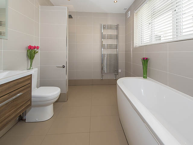 Spacious bathroom with bath and separate walk-in shower