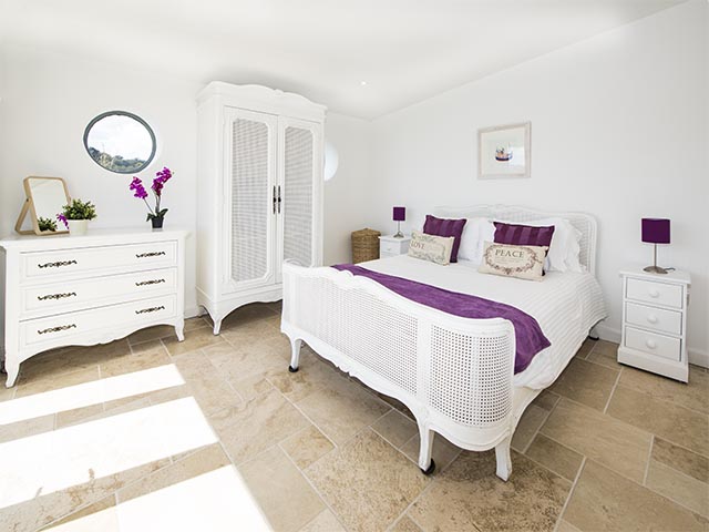 Bedroom one with King-size bed and sea view with access to terrace