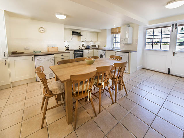 Spacious and well equipped kitchen with dining area