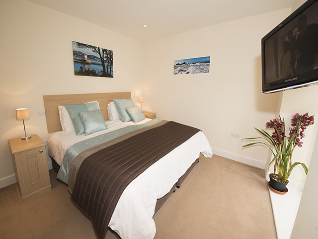 Master bedroom with a double bed which can be made up as 2 single beds