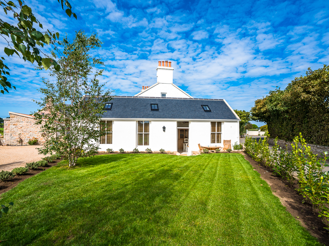 Homestead Cottage is the white property