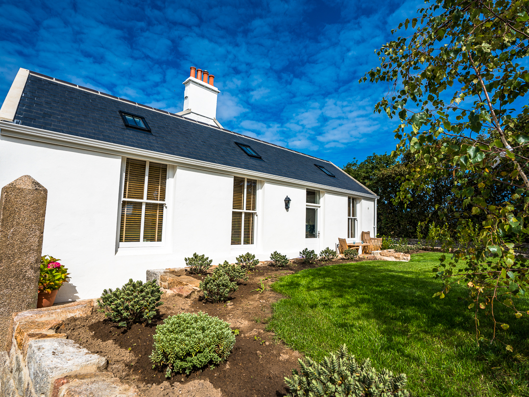 Cottage entrance with patio and garden