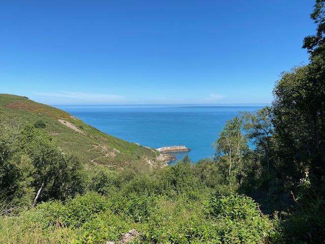 Views over Bouley Bay and distant views towards the Normandy Coast