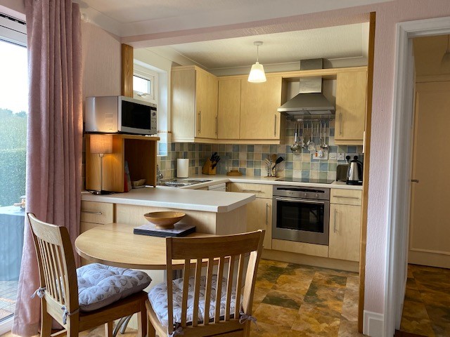 A well equipped kitchen with dining area