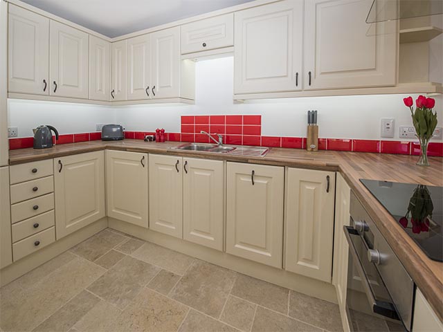 Fully equipped kitchen in open plan room