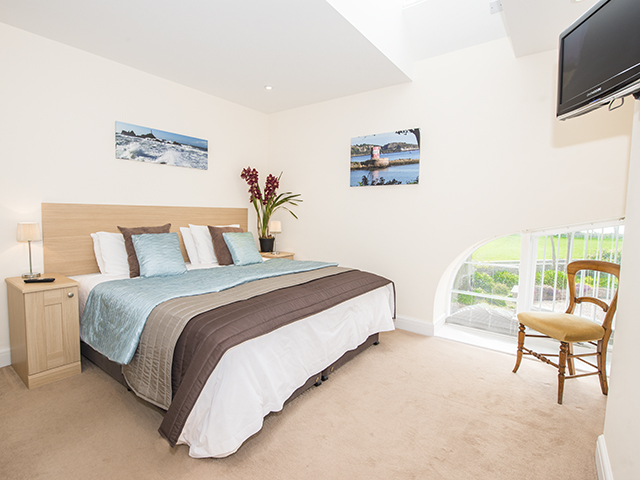 View of master bedroom with king size double bed which can also be made up as 2 singles
