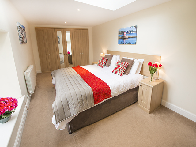 This large bedroom can accommodate another  2 single beds and can be made up as 4 singles or a double and 2 singles