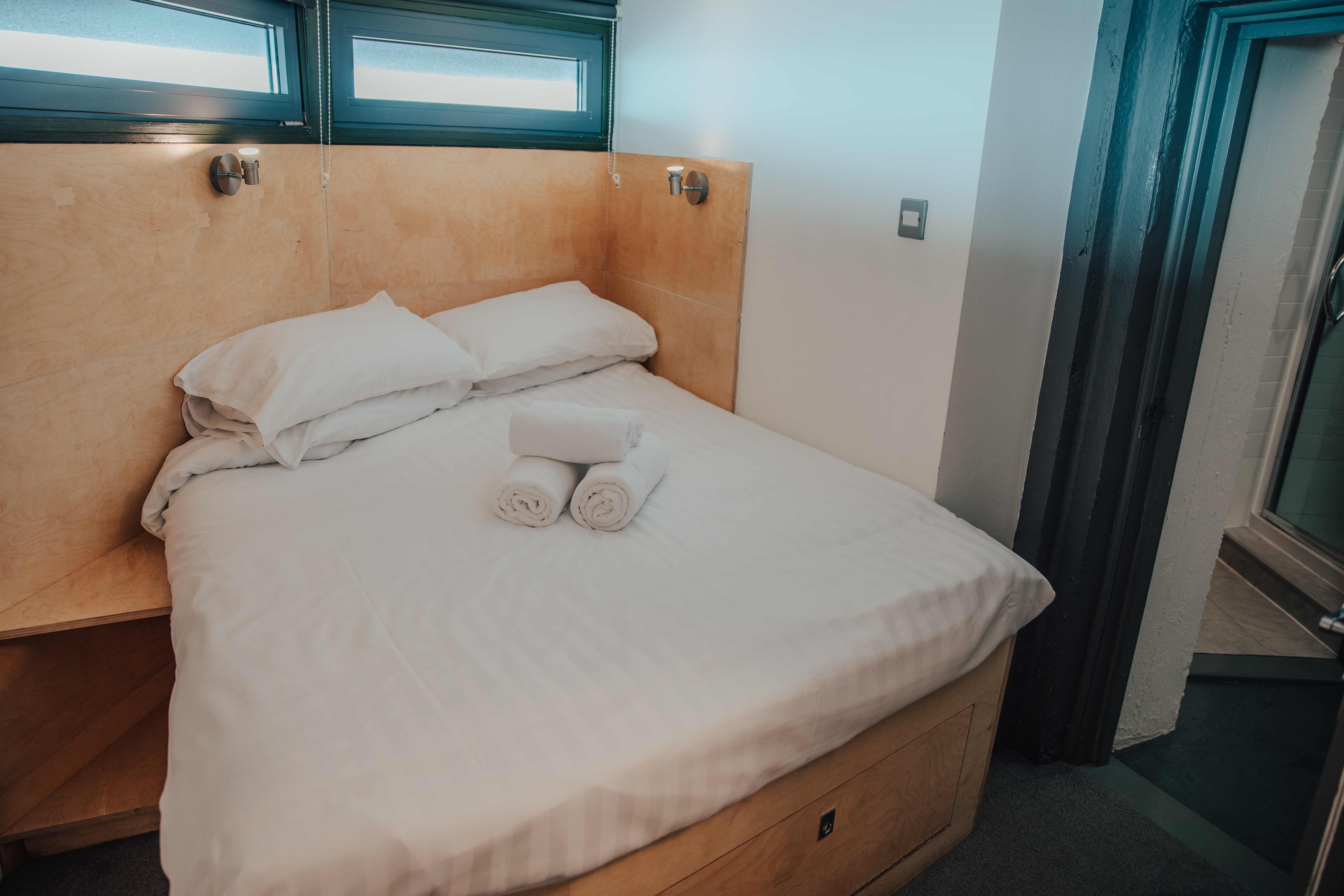 The Radio Tower has 3 identical double bedrooms, all with fitted wardrobes, hand-made beds and their own adjacent shower room with shower, basin and toilet.