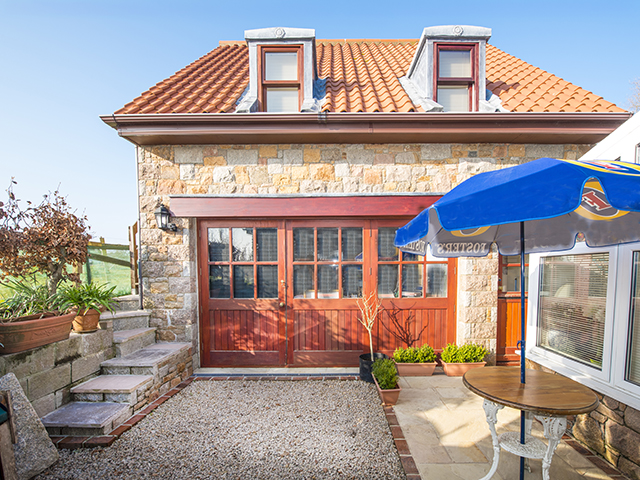 Exterior of first floor apartment, Squirrel's Rest, with patio