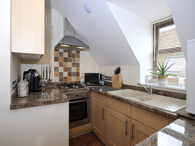 Kitchen area of open-plan apartment