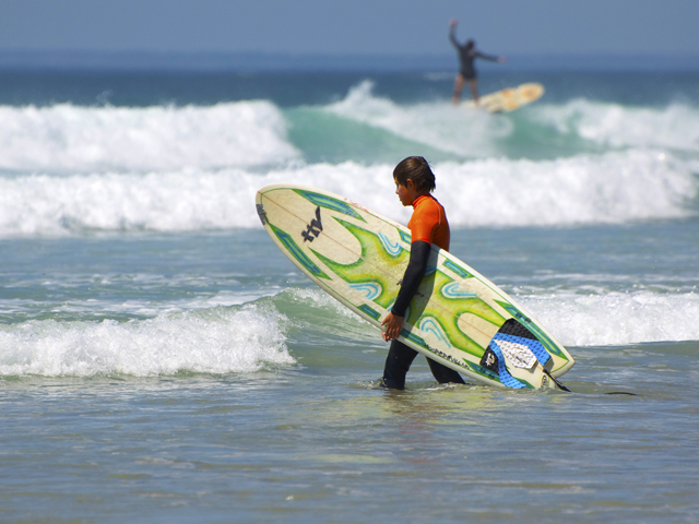 Surfers enjoying the surf at St Ouen's Bay