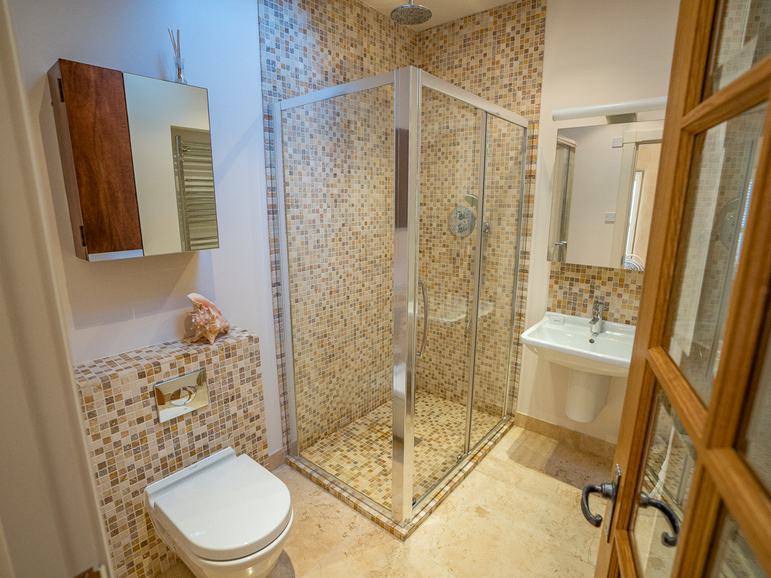 En-suite with large shower, sink and toilet