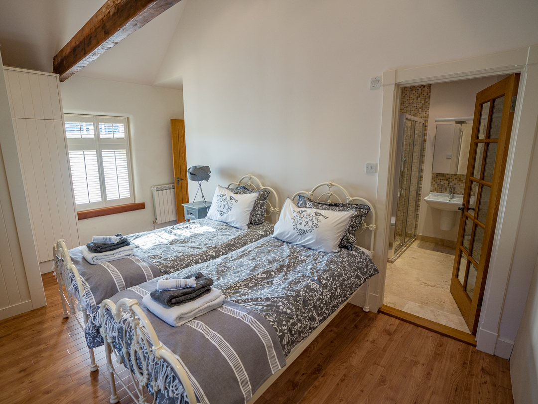 Bedroom with Twin beds and en-suite shower room